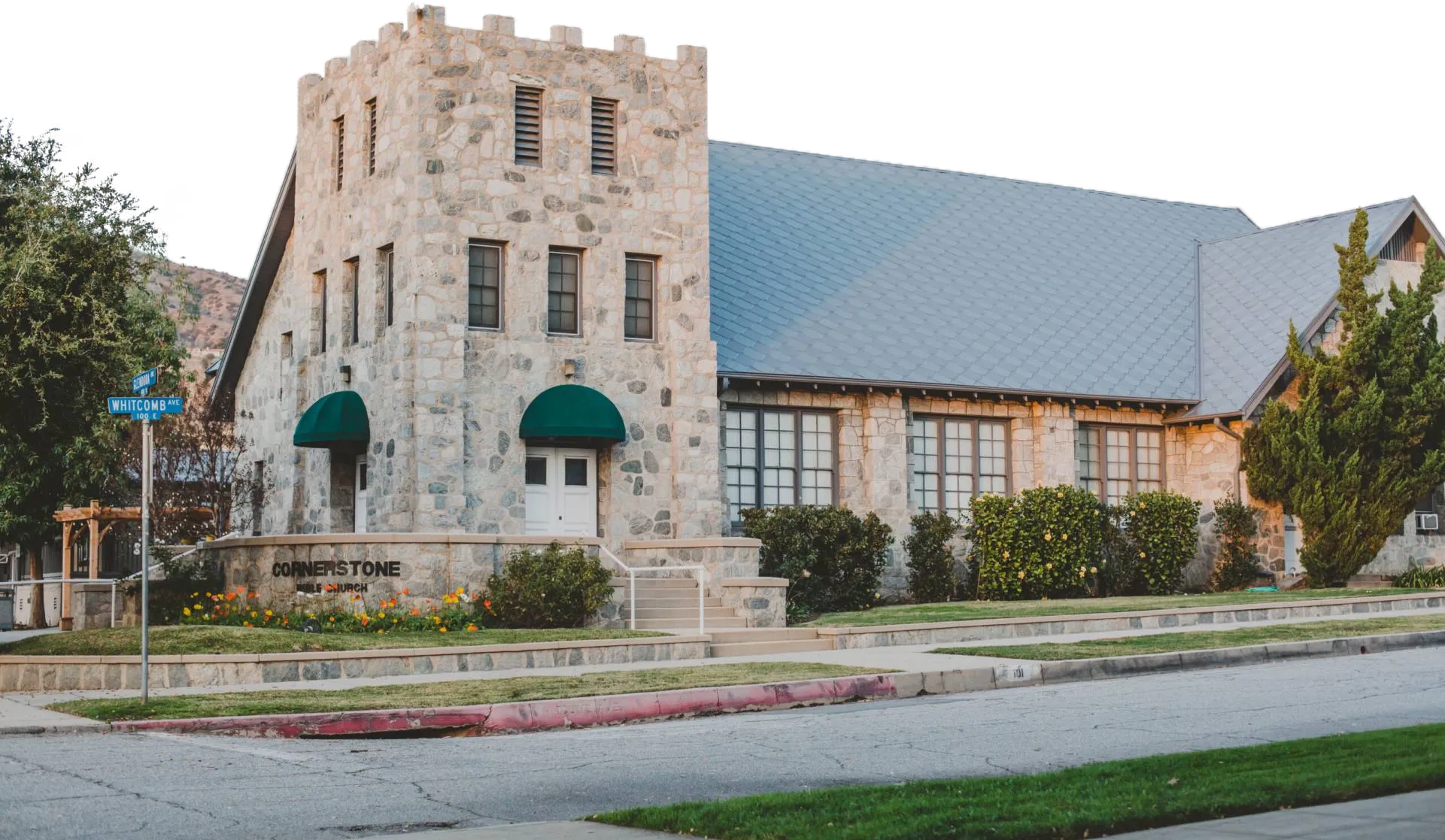 Cornerstone Bible Church stone building at 400 N Glendora Ave