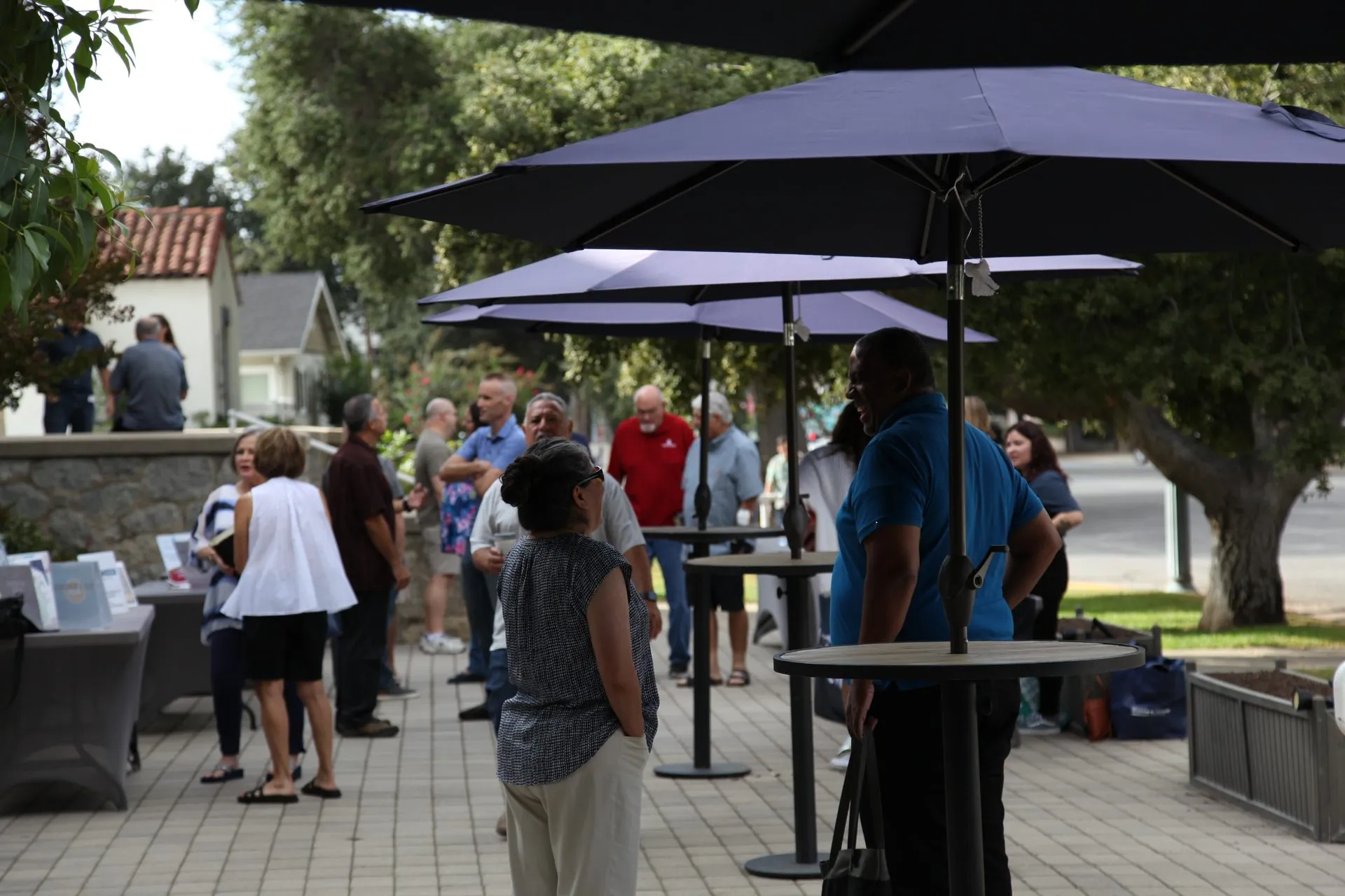 People talking on the courtyard patio after the service