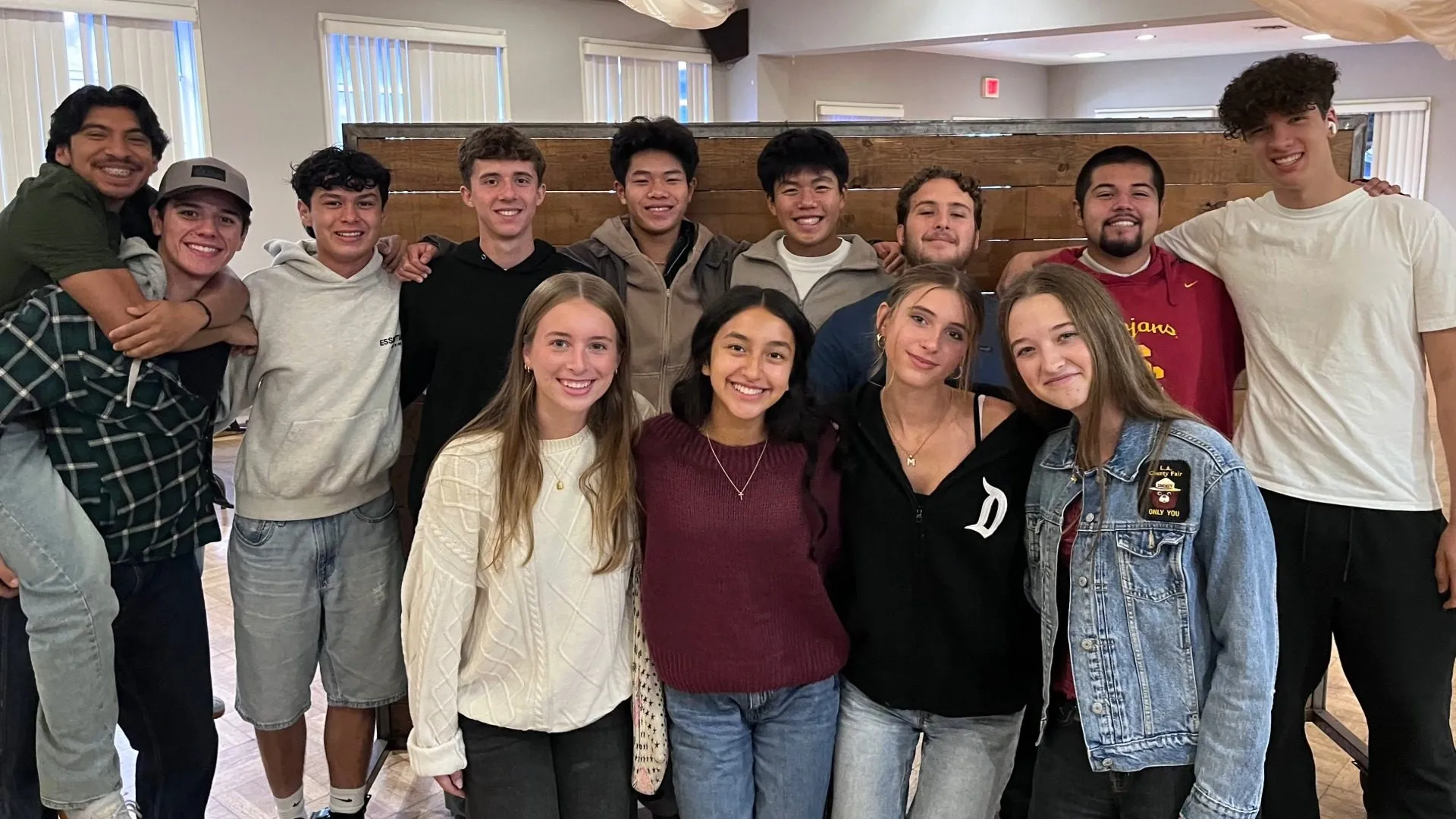 A group of high school students smiling together