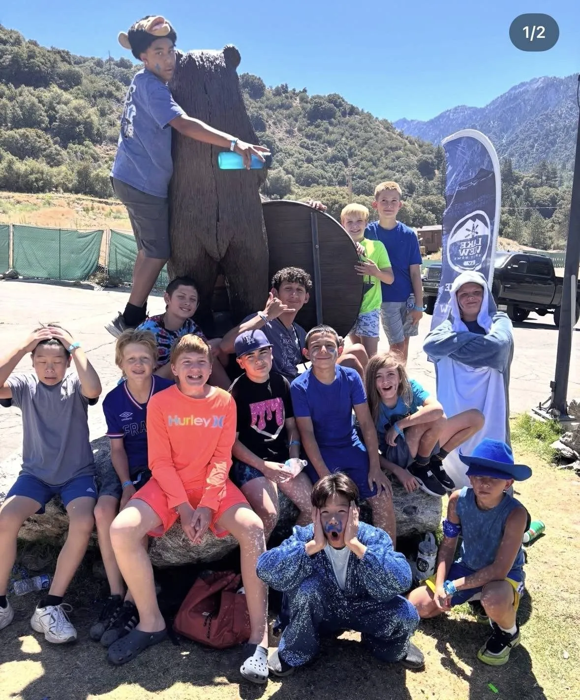 A group of middle school boys posing together at summer camp
